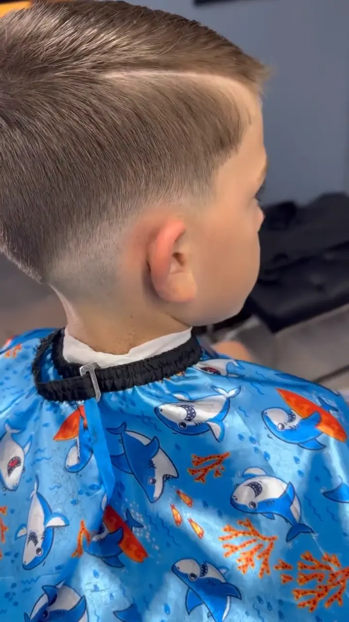 Kids' scissor cut in progress, one of the children's haircuts offered in Palm Beach Gardens