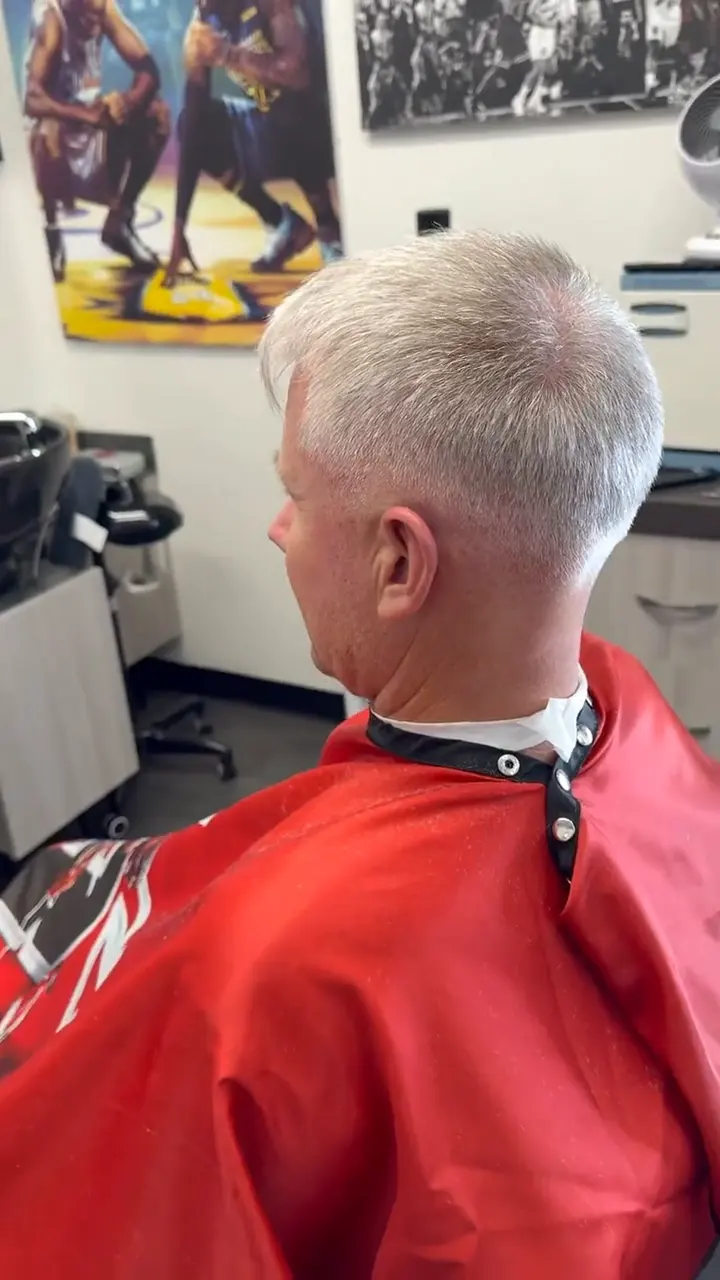 Platinum blonde textured crop with a faded taper on the sides